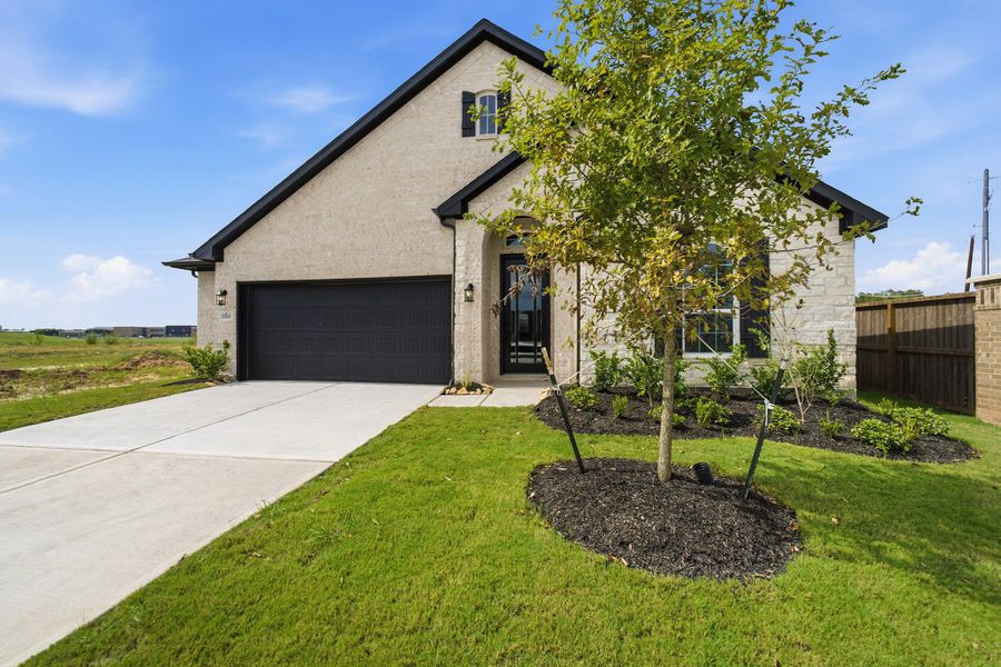 Front exterior of a new home in Ashland, Angleton, TX, highlighting curb appeal (Image 28).