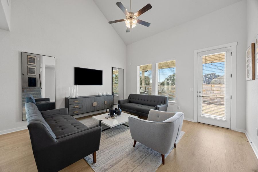 Another view of the Living area featuring natural light and high ceilings.