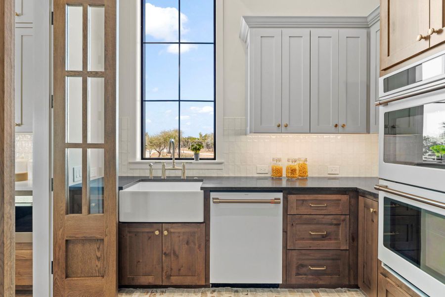 Butler kitchen with full size appliances (double ovens, dishwasher, refrigerator, sink and pantry.