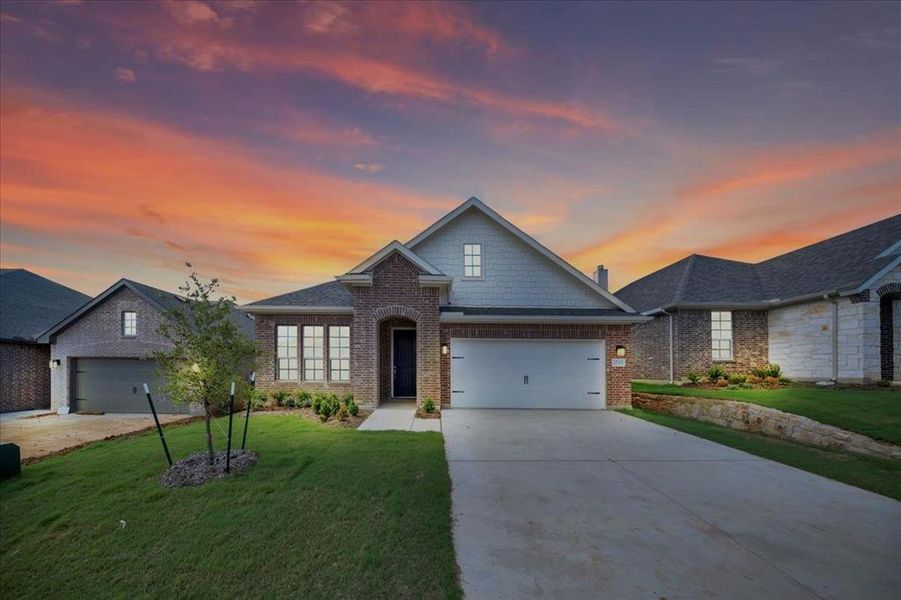 Front exterior of a new home in Liberty Pointe, Gainesville, TX, highlighting curb appeal (Image 22). Front exterior of a new home in Liberty Pointe, Gainesville, TX, highlighting curb appeal (Image 22).