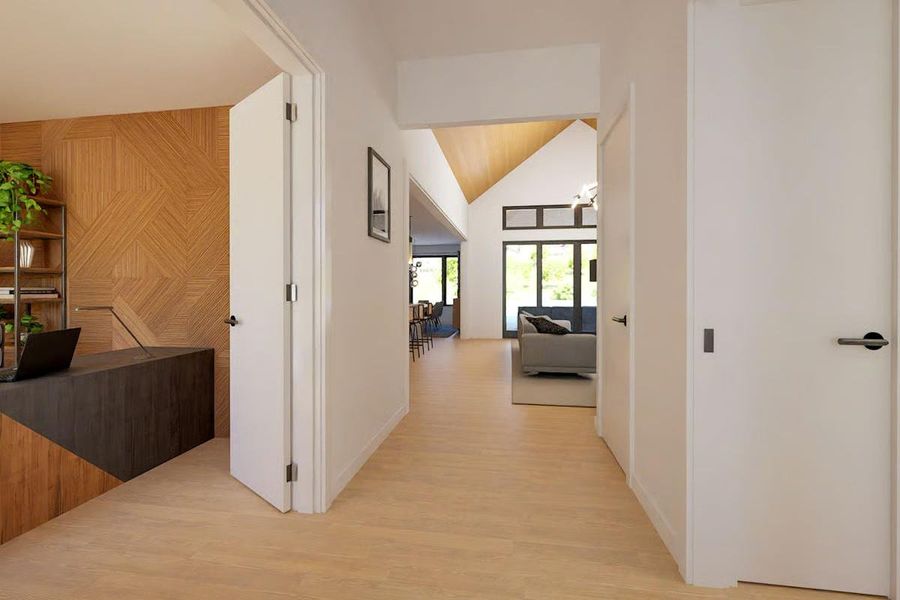 Hallway offers a view of the vaulted ceiling in the Great Room, adding depth and architectural interest. Hallway offers a view of the vaulted ceiling in the Great Room, adding depth and architectural interest.