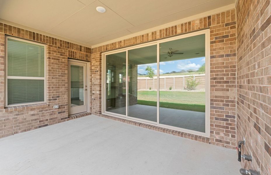 Exterior details and patio area of a home in Bluffview Reserve, Leander (Image 26).