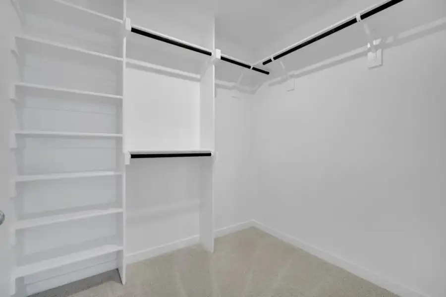 Representative unfurnished interior of a home built from the The Amherst by Lillian Custom Homes in Freeman Farm, Kaufman (Image 46).