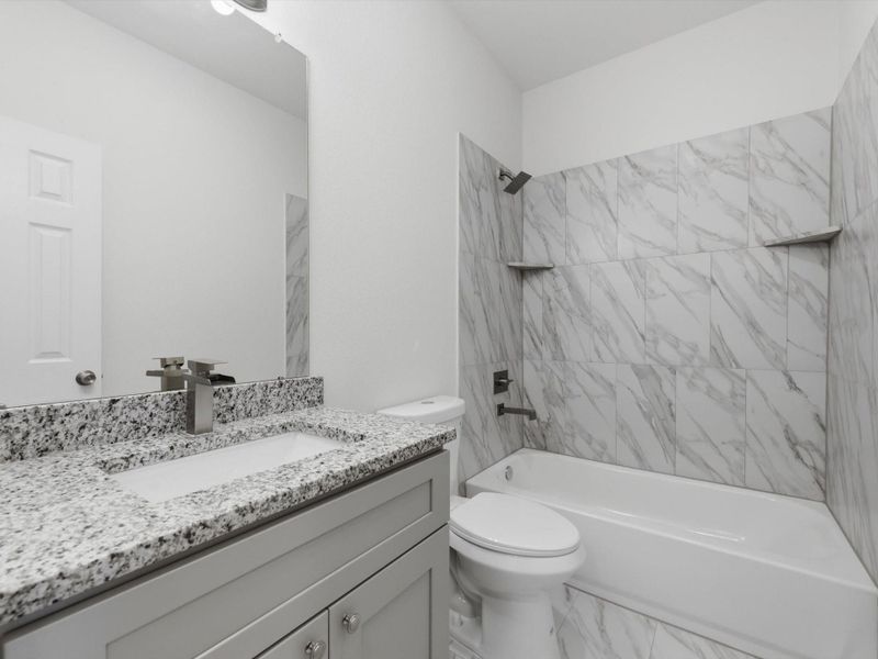 The secondary bathroom is thoughtfully designed with clean lines, modern finishes, and everyday functionality in mind.