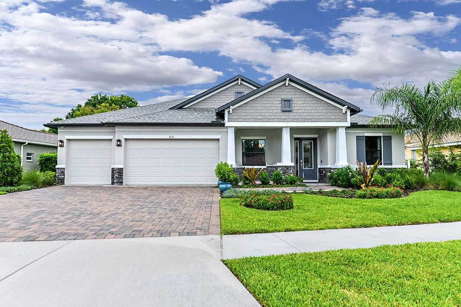 Front exterior of a new home in River Preserve Estates, Parrish, FL, highlighting curb appeal (Image 24).