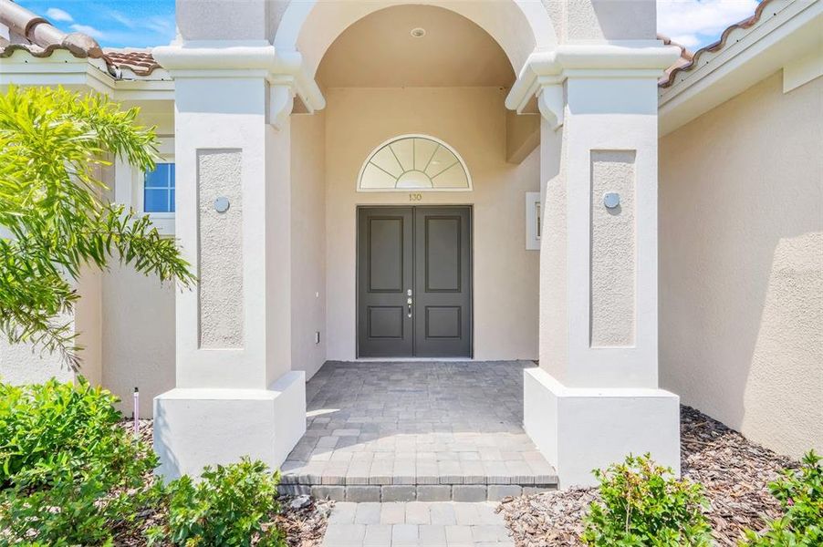 Exterior details and patio area of a home in Toscana, Palm Coast (Image 1).