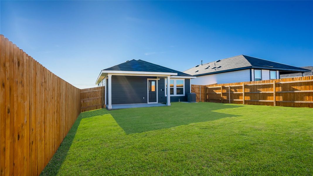 Front exterior of a new home in Marigold, Uhland, TX, highlighting curb appeal (Image 1). Front exterior of a new home in Marigold, Uhland, TX, highlighting curb appeal (Image 1).