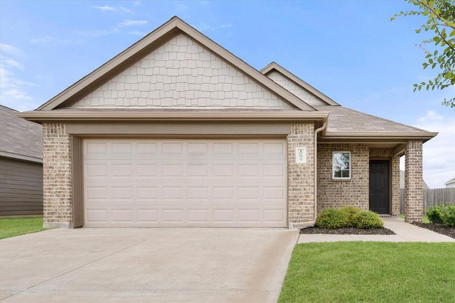 Front exterior of a new home in Deer Creek, Fort Worth, TX, highlighting curb appeal (Image 22).