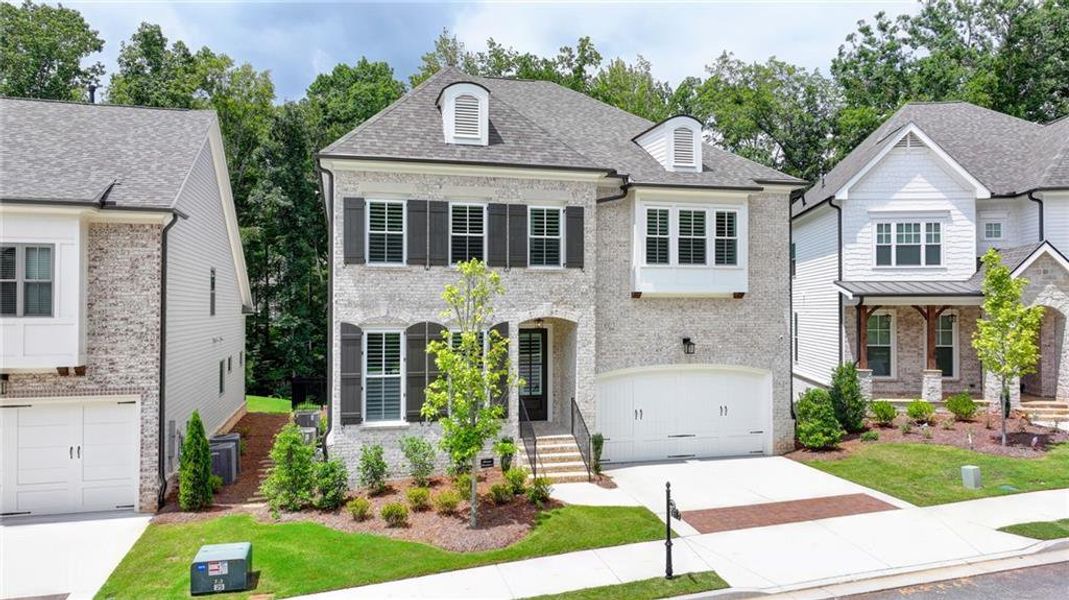 Front exterior of a new home in , Duluth, GA, highlighting curb appeal (Image 2). Front exterior of a new home in , Duluth, GA, highlighting curb appeal (Image 2).