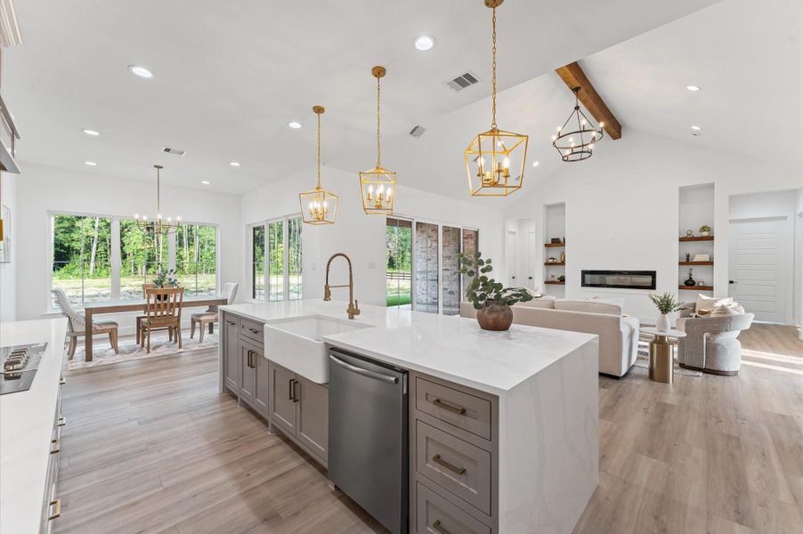 Oversized waterfall island offers bar seating and designer details.Abundant storage and soft-close drawers enhance the kitchen’s convenience and style. Oversized waterfall island offers bar seating and designer details.Abundant storage and soft-close drawers enhance the kitchen’s convenience and style.