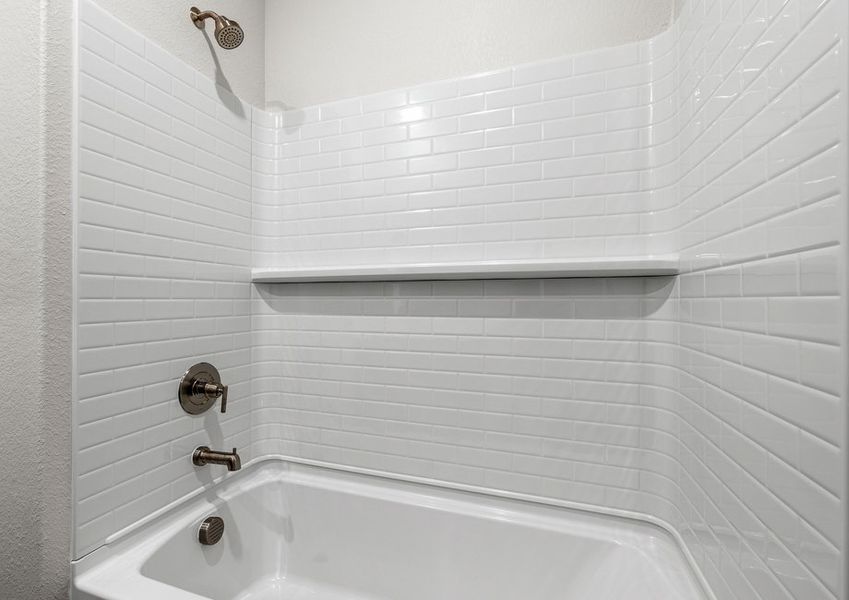 The secondary bathroom has a shower-tub combo.