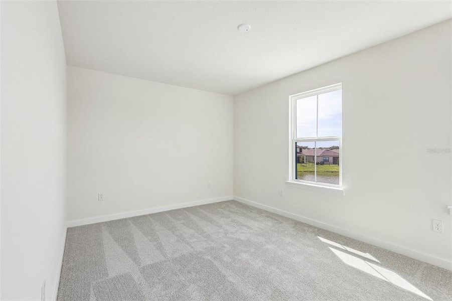 Spacious, unfurnished interior of a new home in Grasslands West, Lakeland (Image 27).