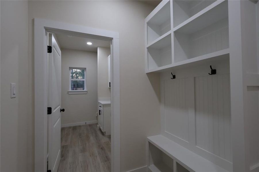 Mudroom featuring light wood-style floors and recessed lighting
