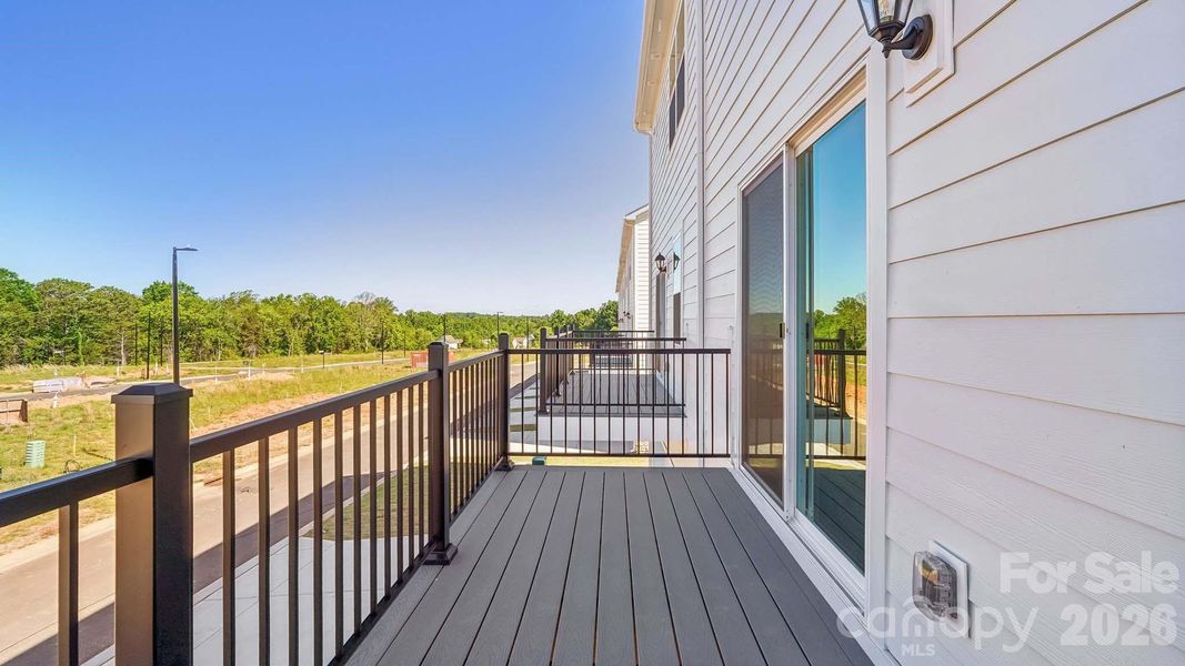 Exterior details and patio area of a home in The Townes at Lake Norman, Mooresville (Image 3).