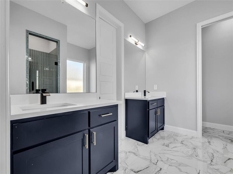 Bathroom featuring two vanities Bathroom featuring two vanities