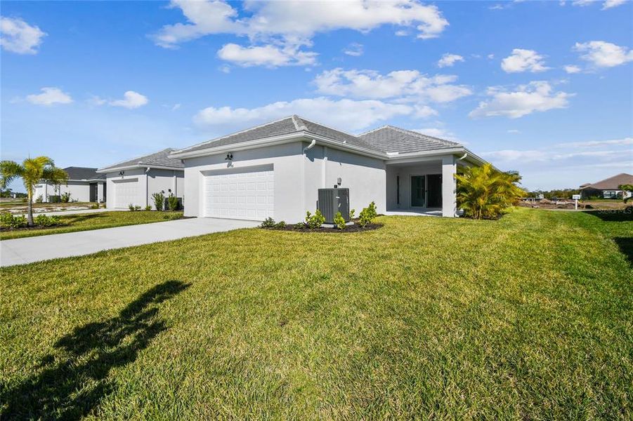 Front exterior of a new home in Vistera of Venice – Cottage Series, Nokomis, FL, highlighting curb appeal (Image 24).