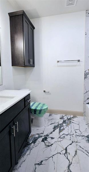 Bathroom with vanity and toilet