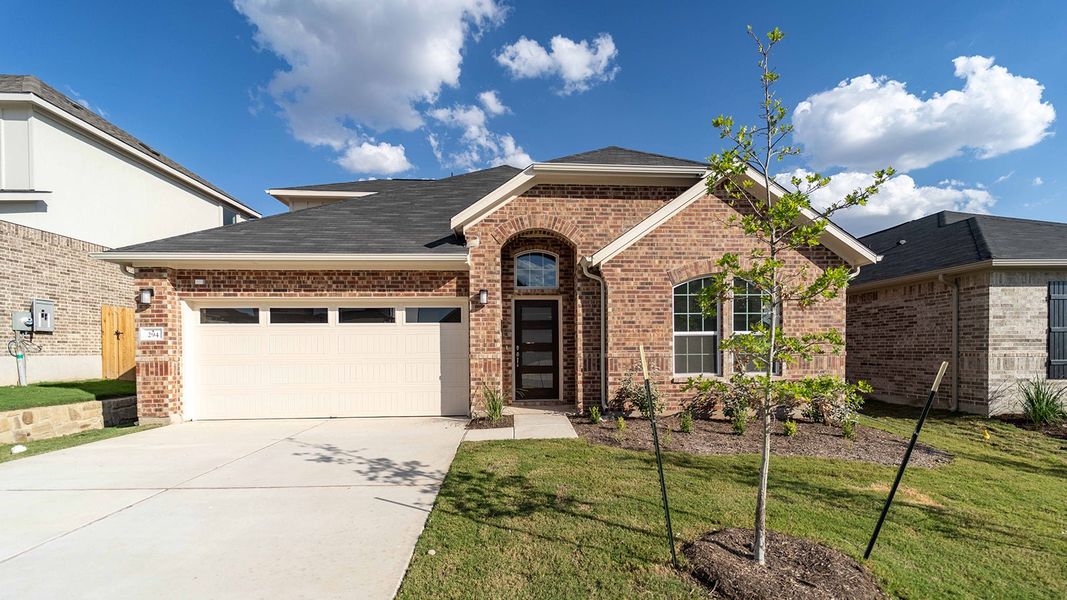 Front exterior of a new home in Sunfield, Buda, TX, highlighting curb appeal (Image 1). Front exterior of a new home in Sunfield, Buda, TX, highlighting curb appeal (Image 1).