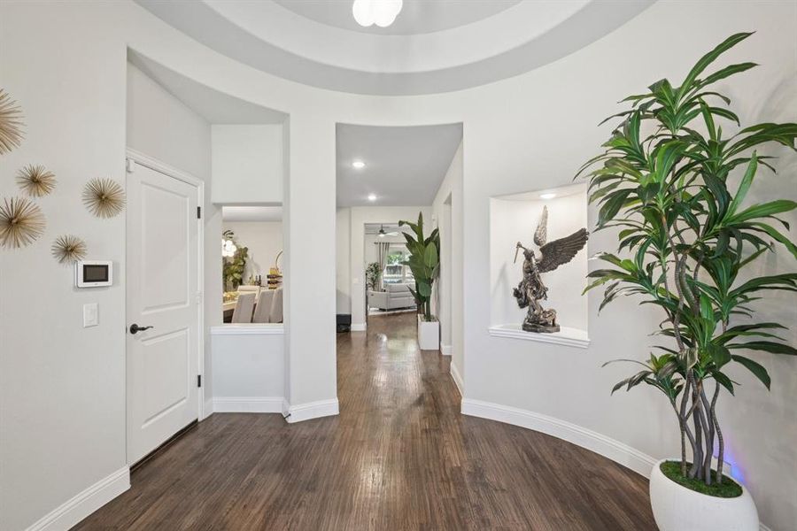 Entryway featuring wood finished floors and baseboards Entryway featuring wood finished floors and baseboards