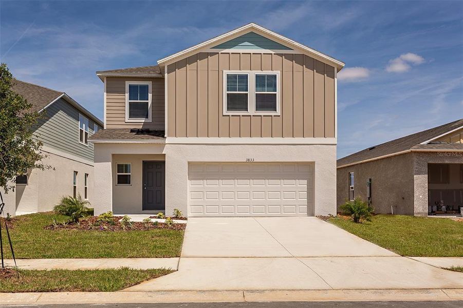 Front exterior of a new home in Villa Mar, Winter Haven, FL, highlighting curb appeal (Image 1). Front exterior of a new home in Villa Mar, Winter Haven, FL, highlighting curb appeal (Image 1).