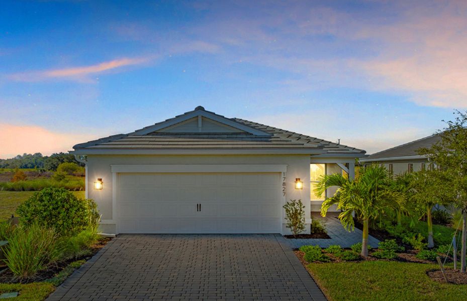 Front exterior of a new home in Del Webb Oak Creek, North Fort Myers, FL, highlighting curb appeal (Image 20).