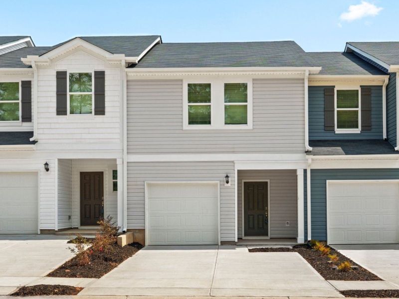 Front exterior of a new home in Avalon Townes, Lyman, SC, highlighting curb appeal (Image 2).