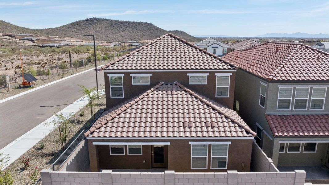 Front exterior of a new home in The Buttes at Mystic, Peoria, AZ, highlighting curb appeal (Image 26).