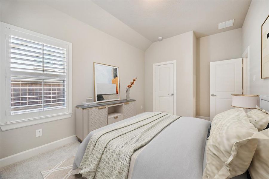 One of two extra secondary bedrooms, shown with virtual staging.