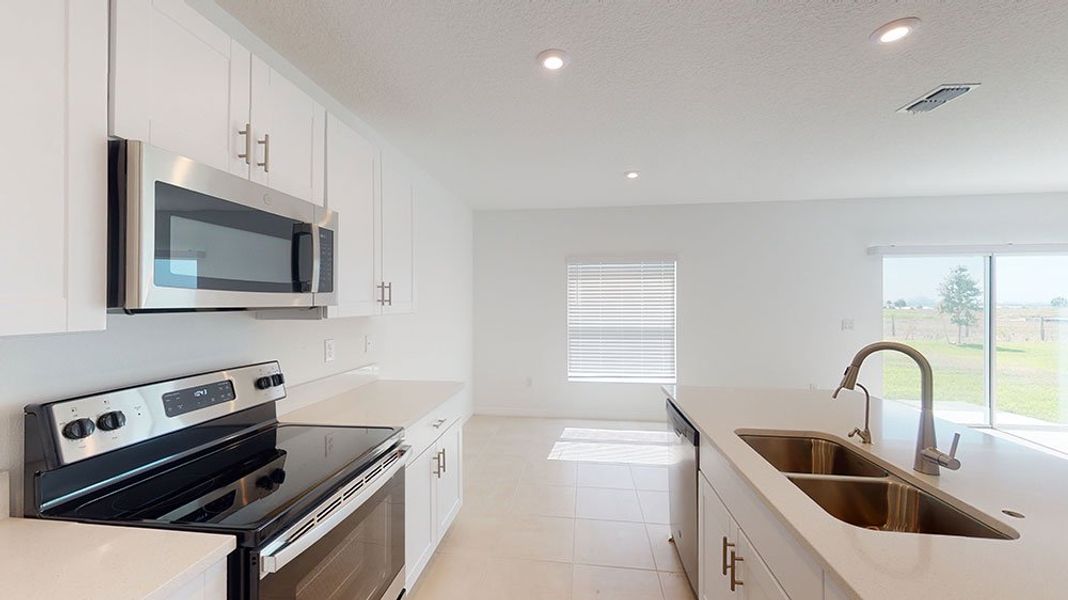 Representative furnished interior of a home built from the Azalea by Taylor Morrison in Riverfront, Edgewater (Image 4).