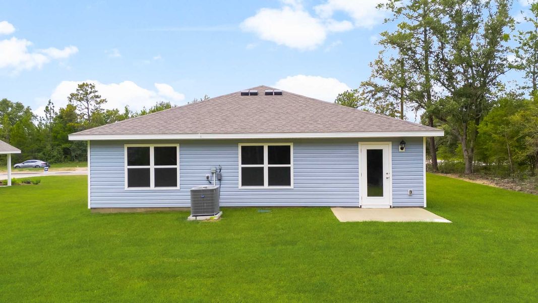 Representative exterior photo of a completed home built from the Freeport by D.R. Horton in Sunny Hills, Chipley, FL (Image 18).
