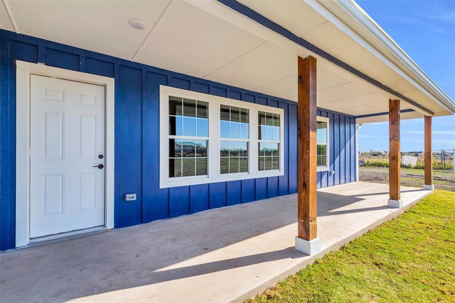 Property entrance with board and batten siding Property entrance with board and batten siding