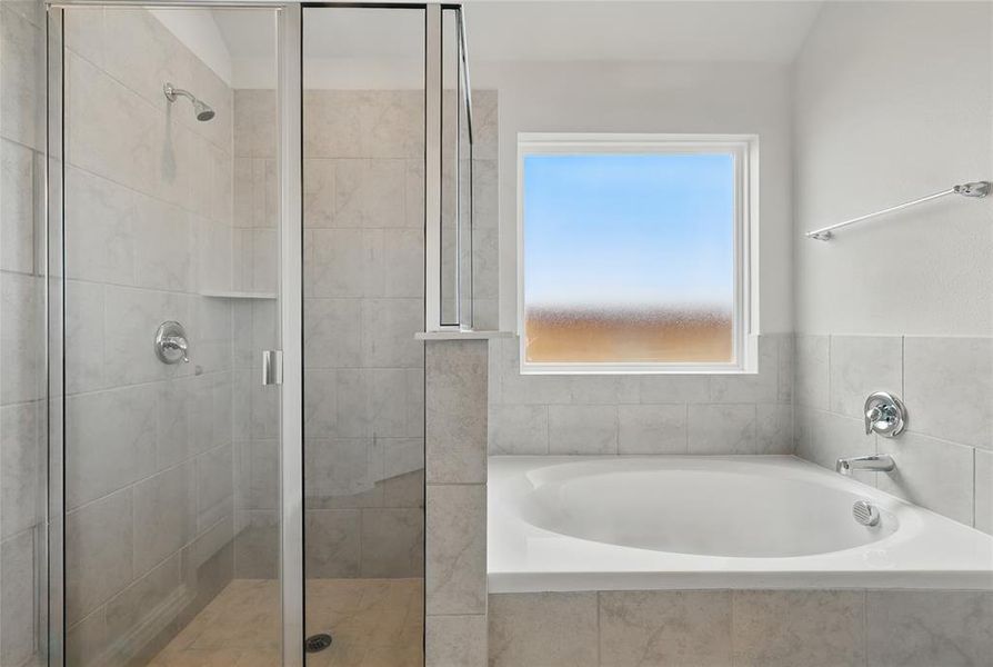 Full bathroom with a shower stall and a garden tub Full bathroom with a shower stall and a garden tub