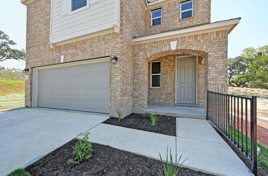 Exterior details and patio area of a home in Creekside at Estancia, Austin (Image 3).