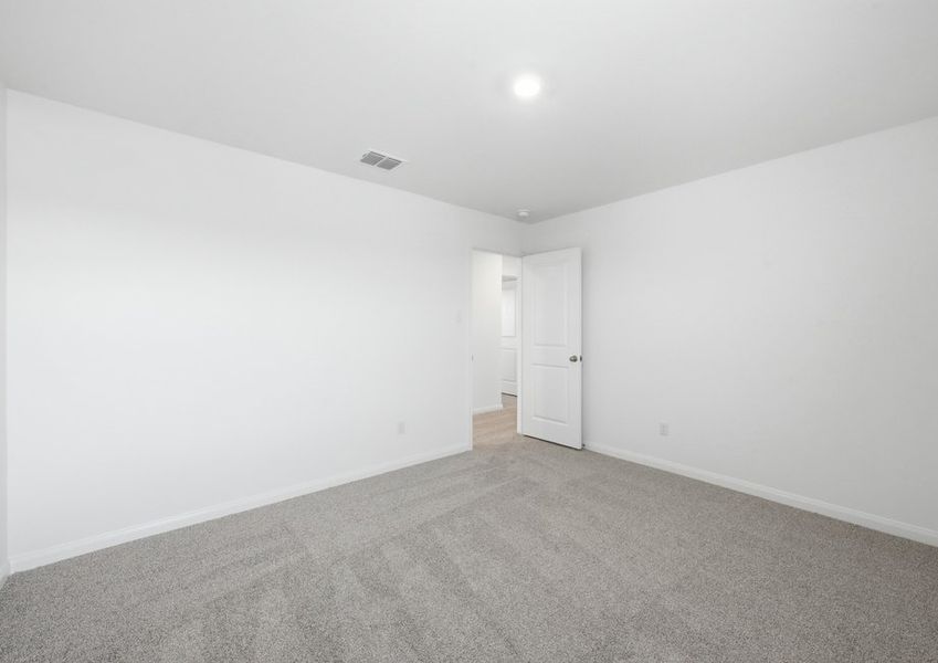 Carpeted Bedroom 5 featuring neutral wall color and natural light. Carpeted Bedroom 5 featuring neutral wall color and natural light.