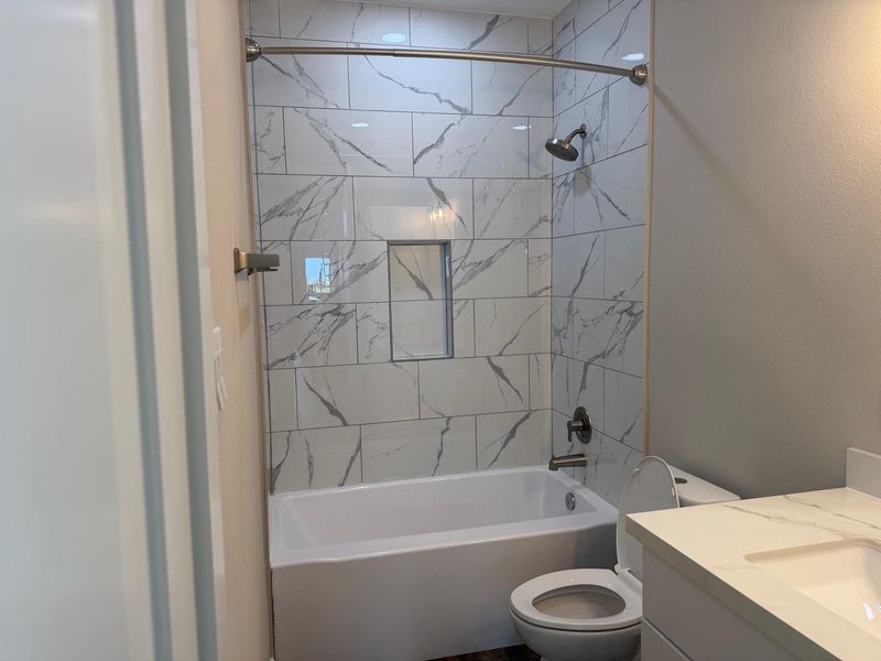 Tub and Tile shower combos in bathroom. Main floor/2nd Floor