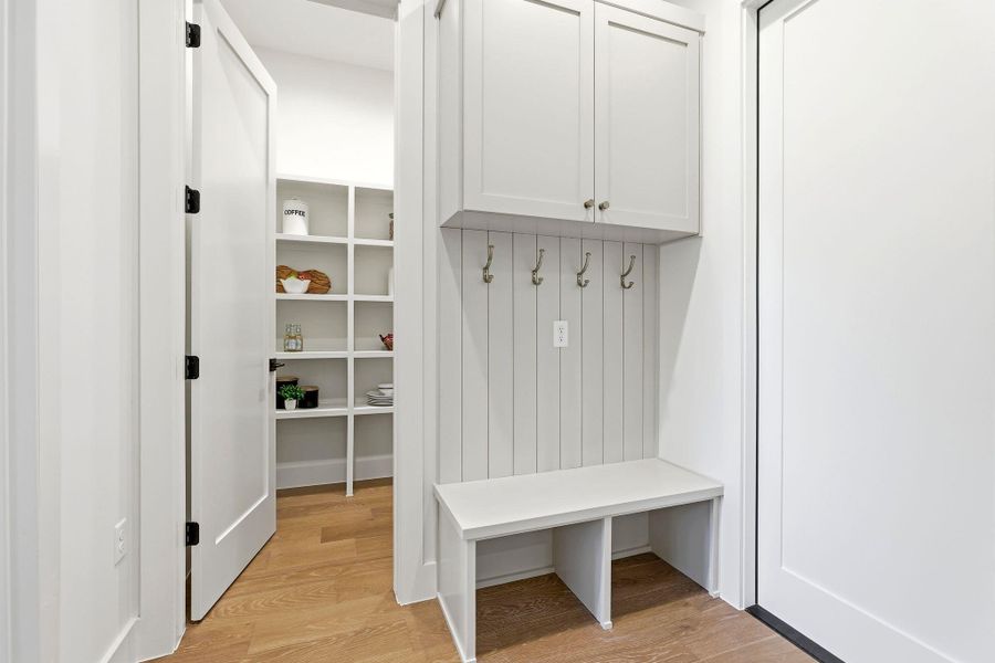 Mudroom with light wood-style floors Mudroom with light wood-style floors