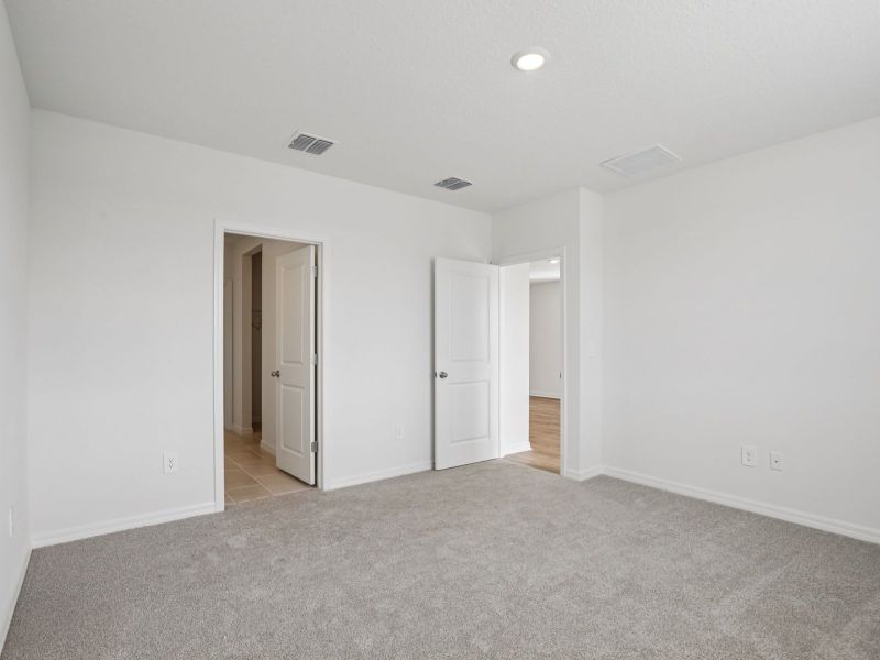 Spacious, unfurnished interior of a new home in The Grove at Stuart Crossing - Premier Series, Bartow (Image 11). Spacious, unfurnished interior of a new home in The Grove at Stuart Crossing - Premier Series, Bartow (Image 11).