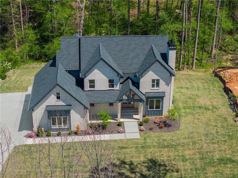 Front exterior of a new home in , Hoschton, GA, highlighting curb appeal (Image 26).