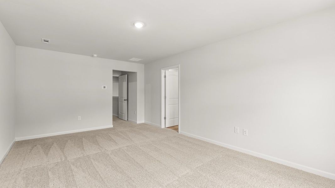Representative unfurnished interior of a home built from the Salisbury by D.R. Horton in Waypoint, Flowery Branch (Image 22).