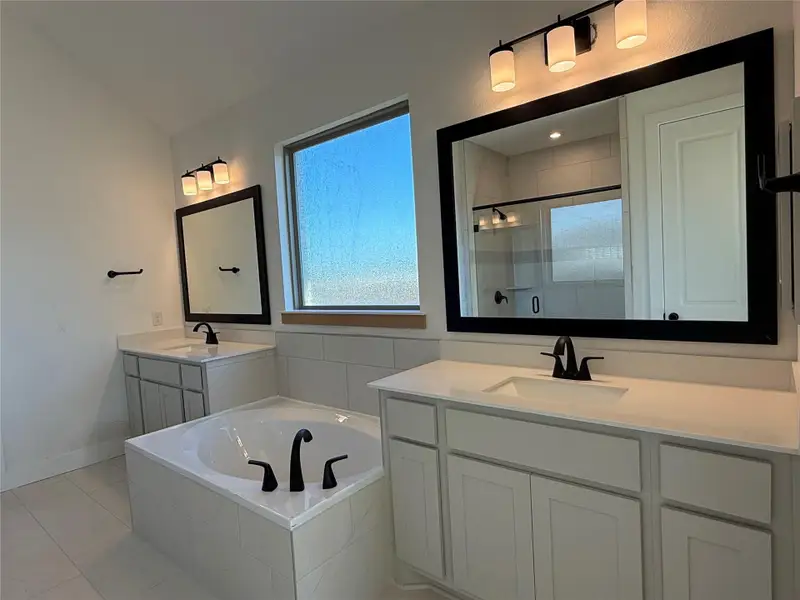 Primary Bath retreat with dual vanities & garden tub Primary Bath retreat with dual vanities & garden tub