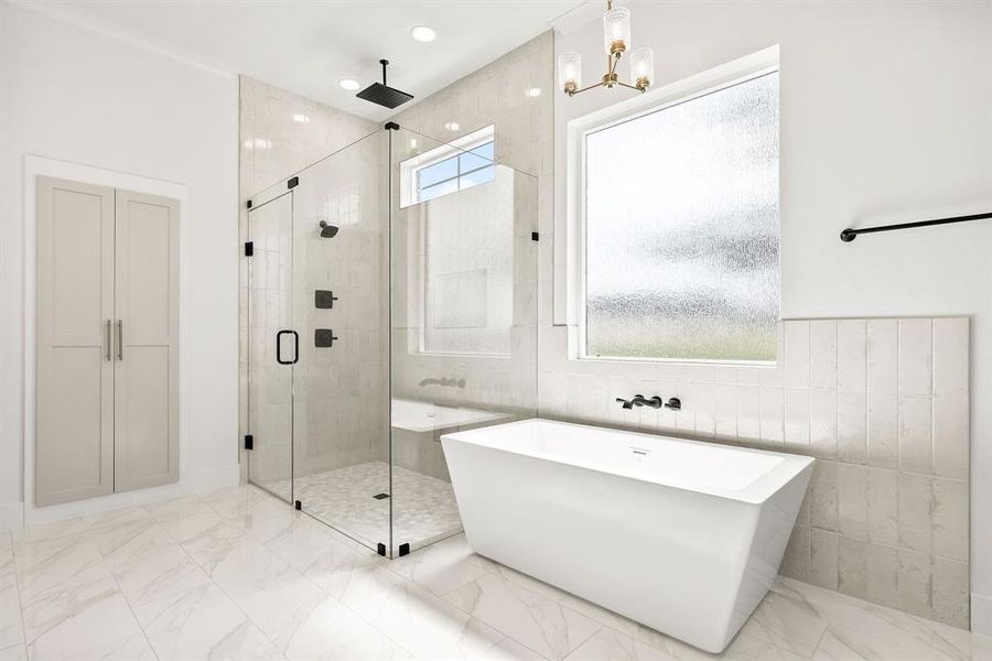Bathroom with a shower stall, a freestanding bath, marble finish flooring, and tile walls Bathroom with a shower stall, a freestanding bath, marble finish flooring, and tile walls