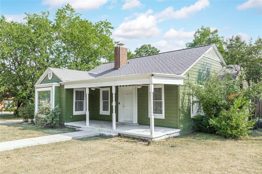 View of front of house featuring covered porch, a front yard, and roof with shingles View of front of house featuring covered porch, a front yard, and roof with shingles