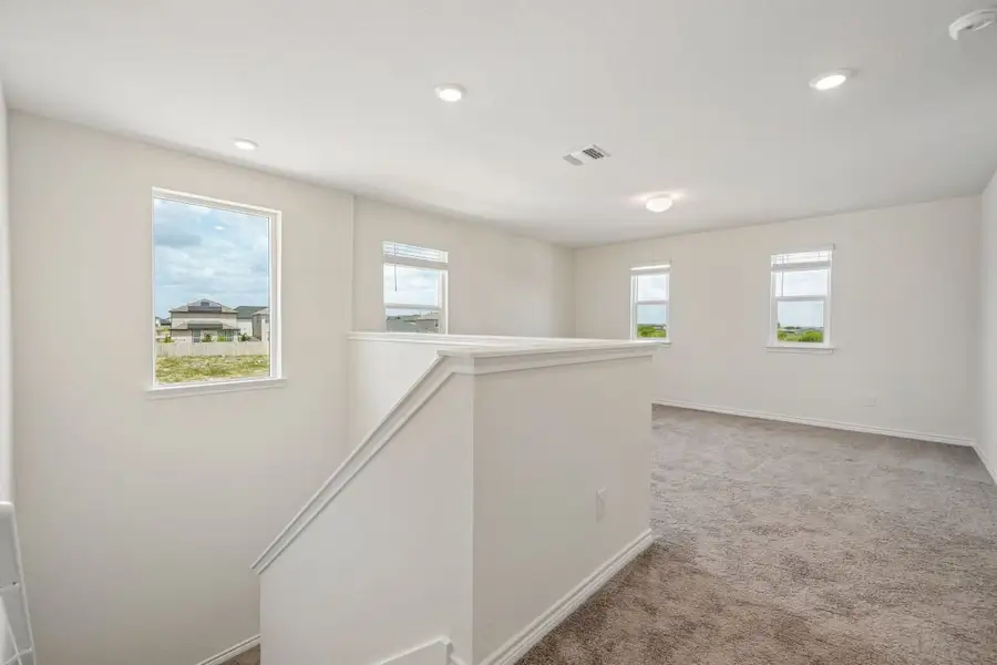 Spacious, unfurnished interior of a new home in Preserve at Culebra - Sterling Collection, San Antonio (Image 20).