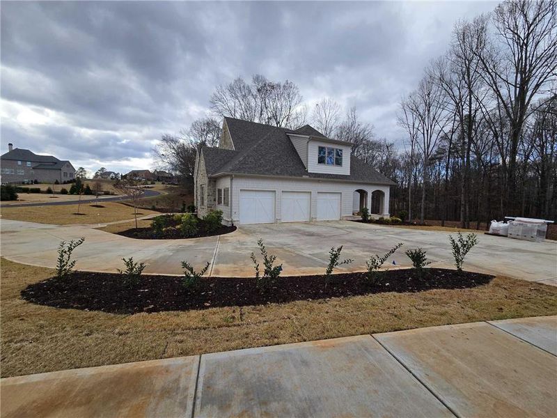 Front exterior of a new home in , Flowery Branch, GA, highlighting curb appeal (Image 9).