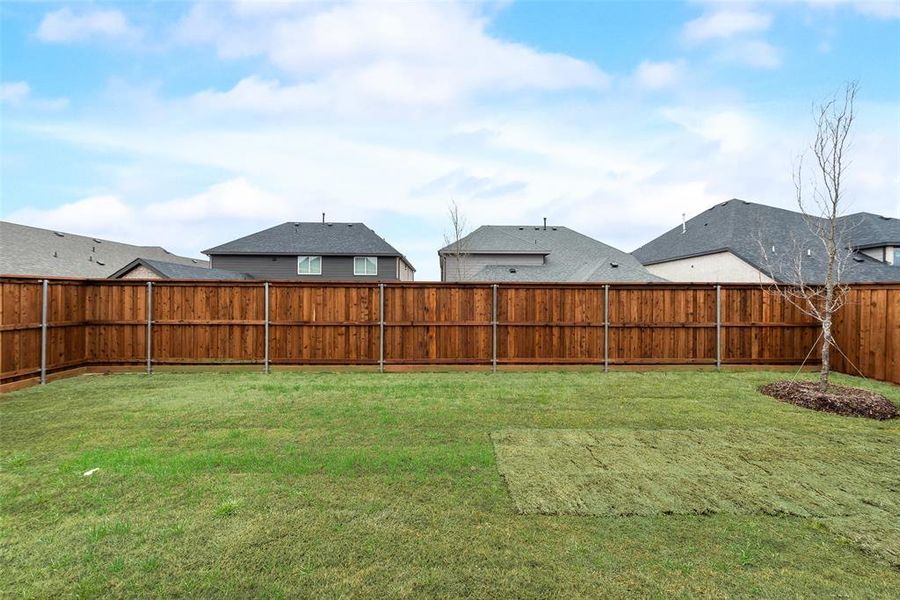 Exterior details and patio area of a home in Spiritas Ranch, Little Elm (Image 4).