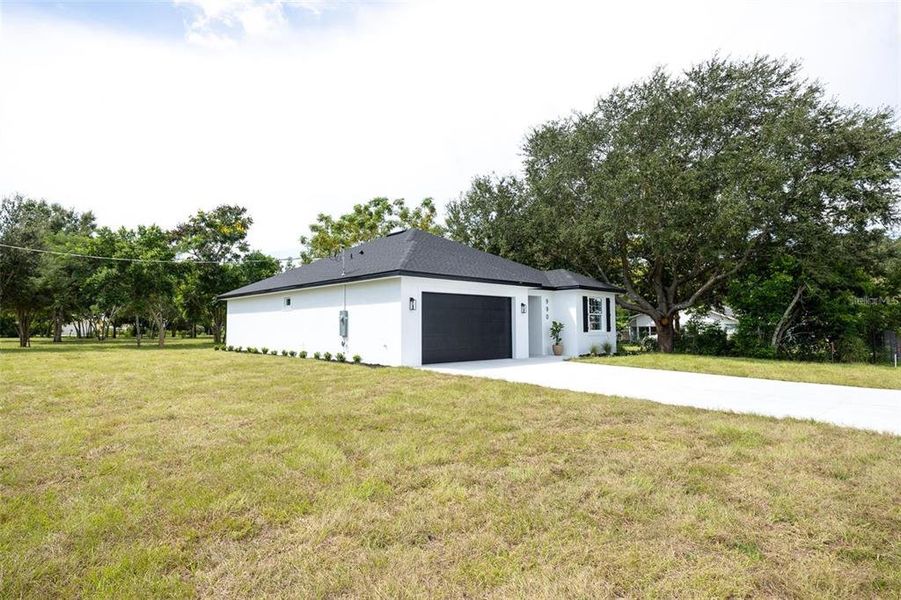 Front exterior of a new home in , Eagle Lake, FL, highlighting curb appeal (Image 28). Front exterior of a new home in , Eagle Lake, FL, highlighting curb appeal (Image 28).