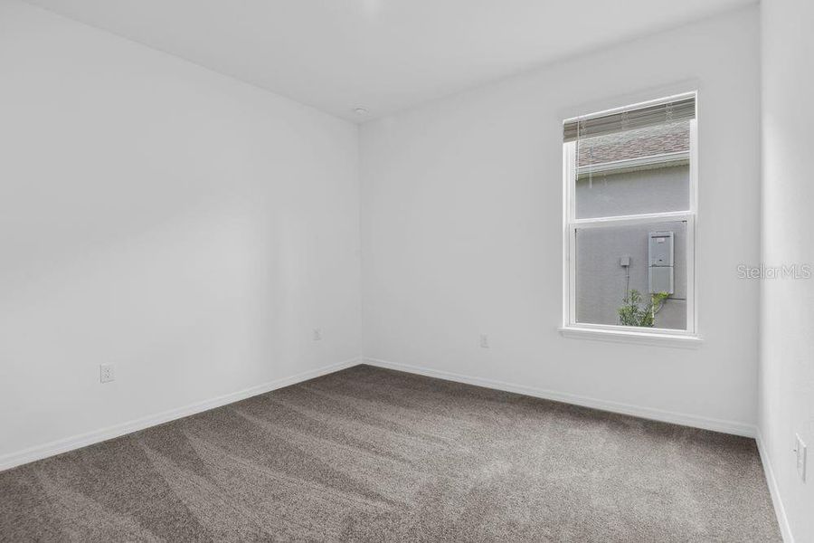 Spacious, unfurnished interior of a new home in Ardisia Park, New Smyrna Beach (Image 38).