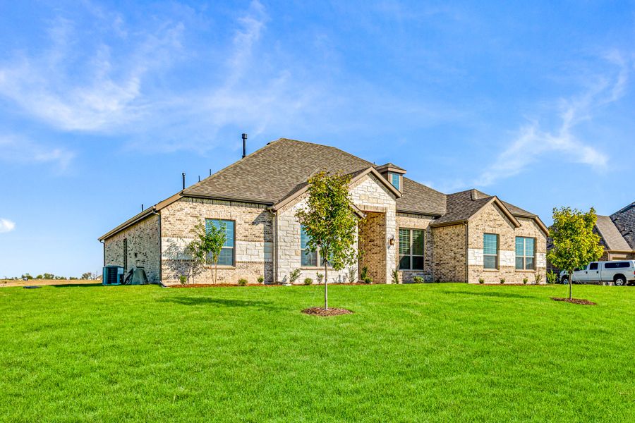 Front exterior of a new home in Creekview Farms, Greenville, TX, highlighting curb appeal (Image 25). Front exterior of a new home in Creekview Farms, Greenville, TX, highlighting curb appeal (Image 25).