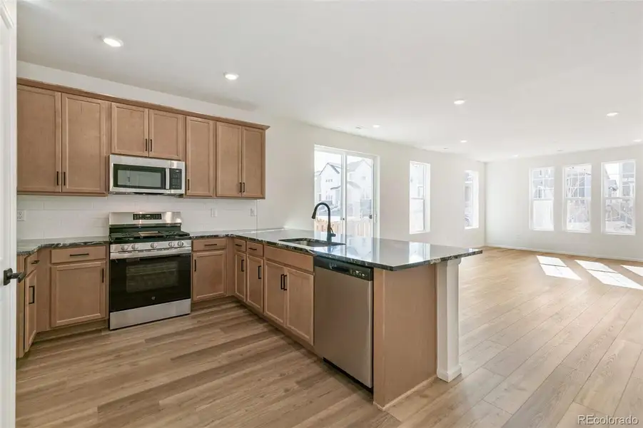 Furnished interior view inside a new home in Turnberry Villas, Commerce City (Image 8).