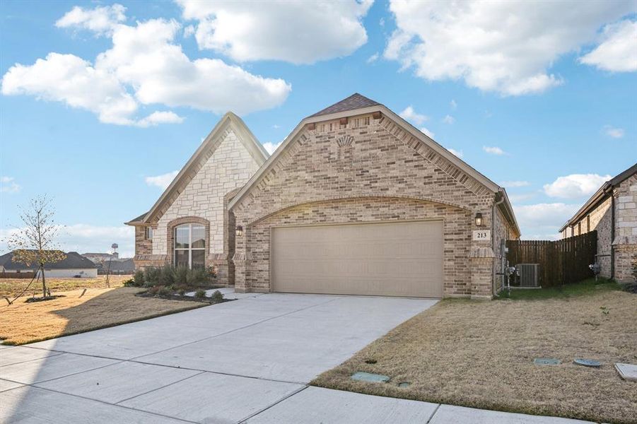 Front exterior of a new home in , Alvarado, TX, highlighting curb appeal (Image 22).